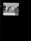 Three girls and a guy with tennis rackets (1 Negative), undated [Sleeve 2, Folder c, Box 45]